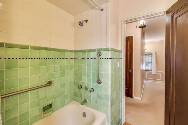 a bathroom with a shower and a sink