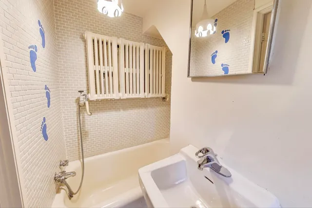 a bathroom with a sink and a mirror