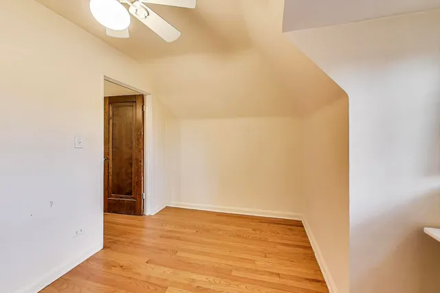 a view of hallway with wooden floor