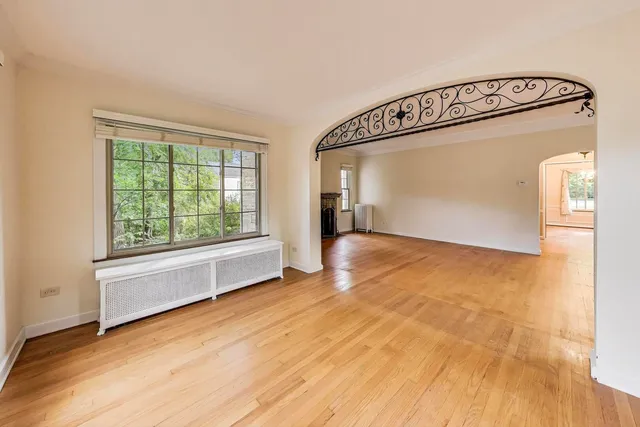 a view of an empty room with glass door