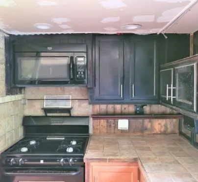 a kitchen with a stove and a microwave