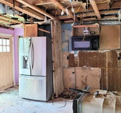 a bathroom with a refrigerator and a stove