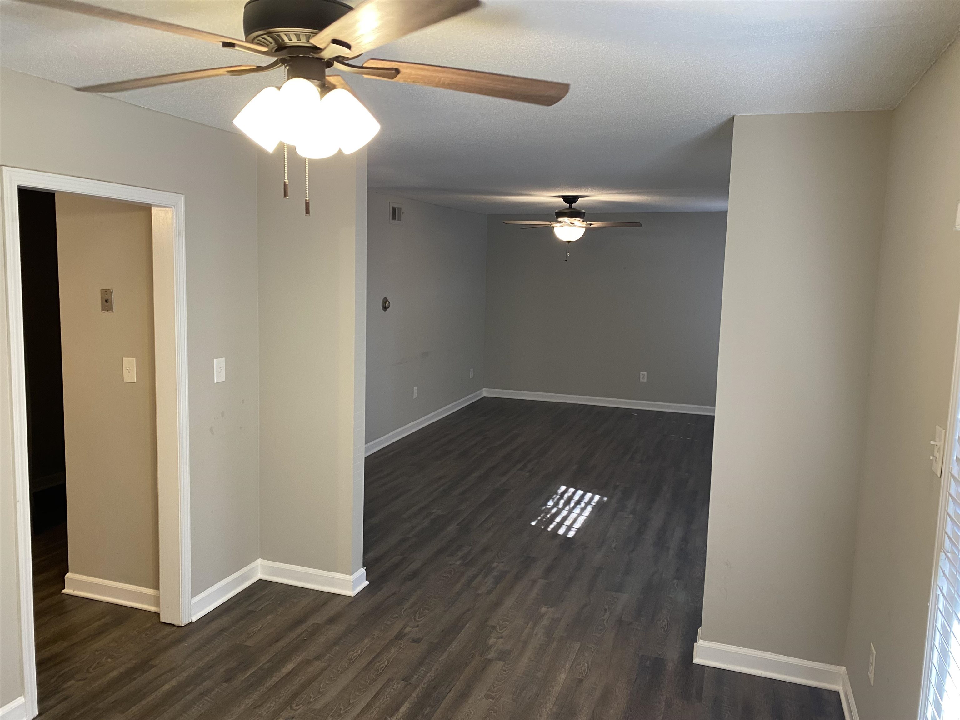 5696 Quince Road, Unit 7 Memphis, TN 38119 - Photo 15 of 15 wooden floor in an empty room with a window