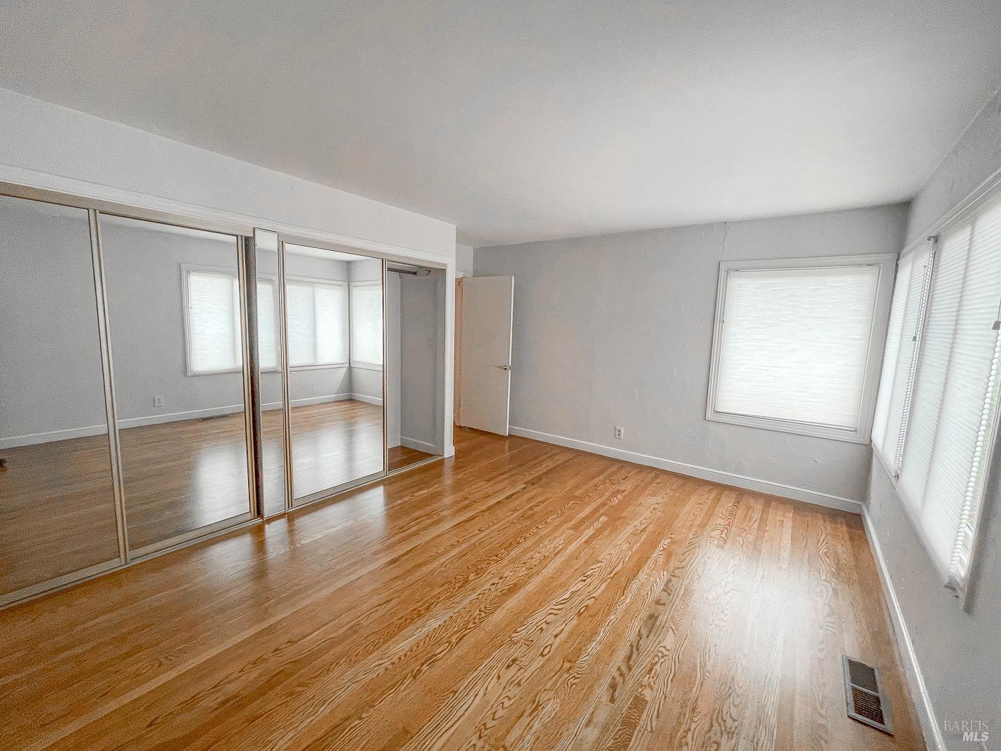 112 Reed Boulevard Mill Valley, CA 94941 - Photo 11 of 39 wooden floor in an empty room with a window