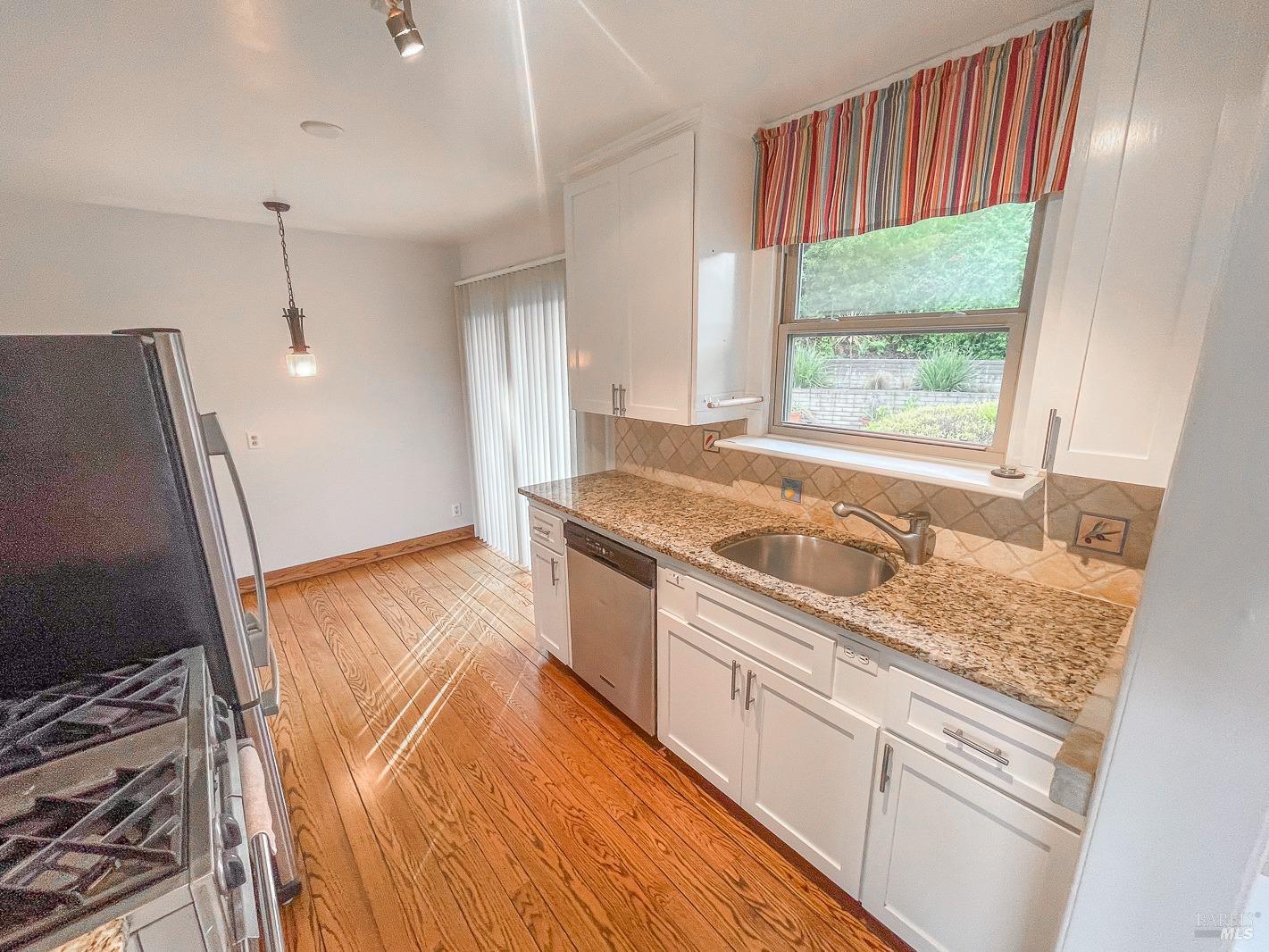 112 Reed Boulevard Mill Valley, CA 94941 - Photo 19 of 39 a kitchen with a sink stove and refrigerator