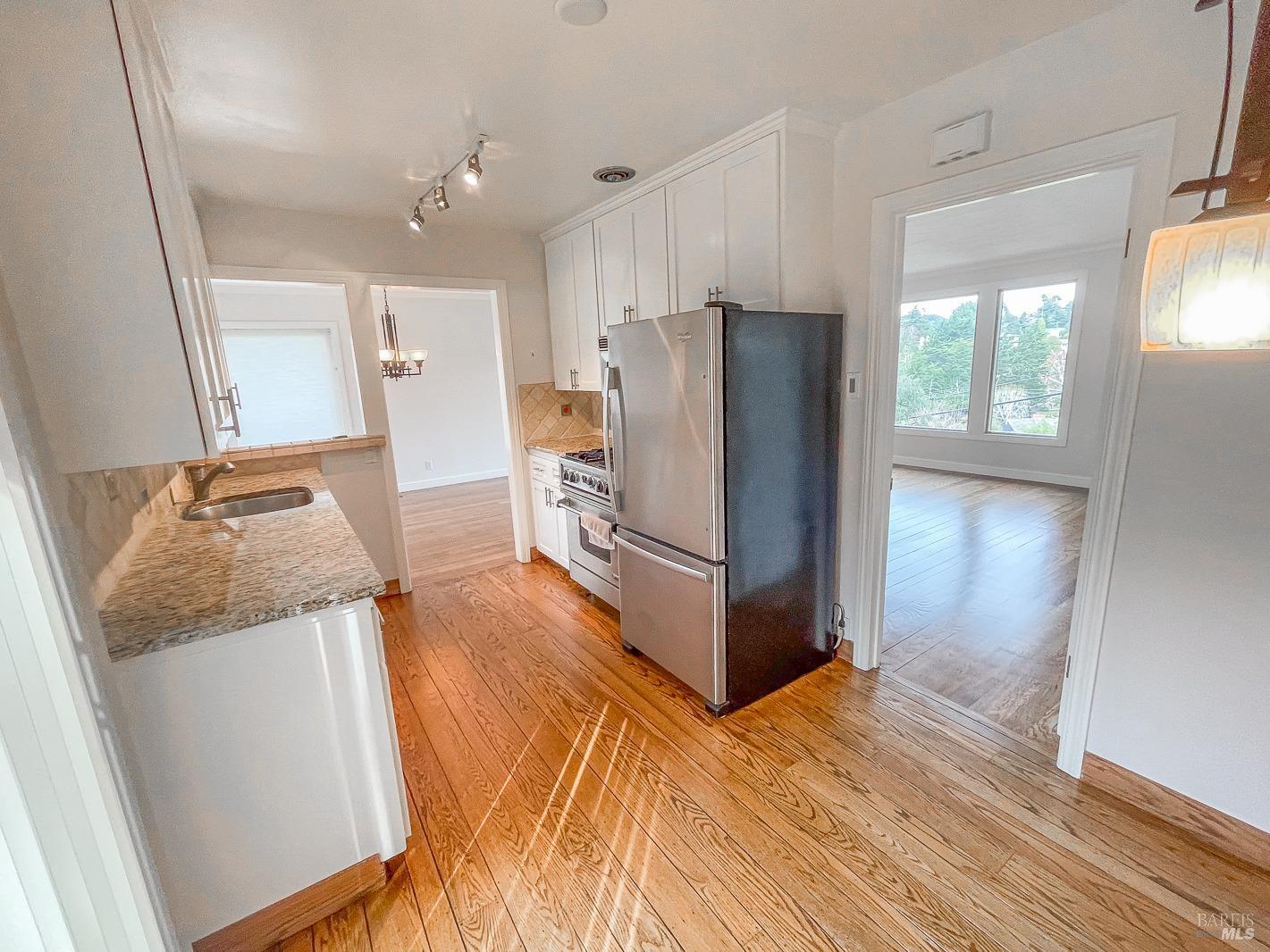 112 Reed Boulevard Mill Valley, CA 94941 - Photo 20 of 39 a kitchen with stainless steel appliances a refrigerator and a stove