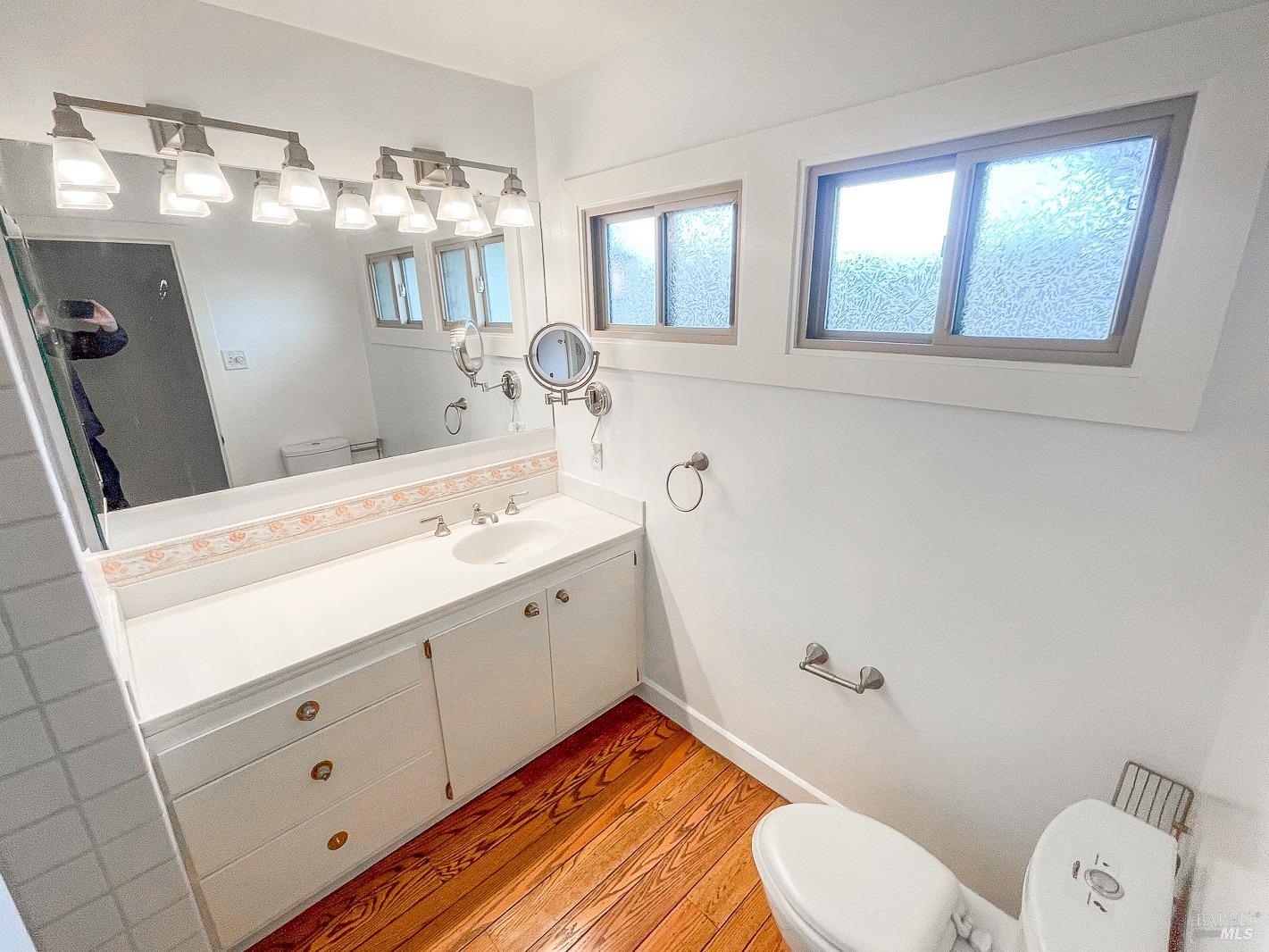 112 Reed Boulevard Mill Valley, CA 94941 - Photo 28 of 39 a bathroom with a toilet sink and mirror