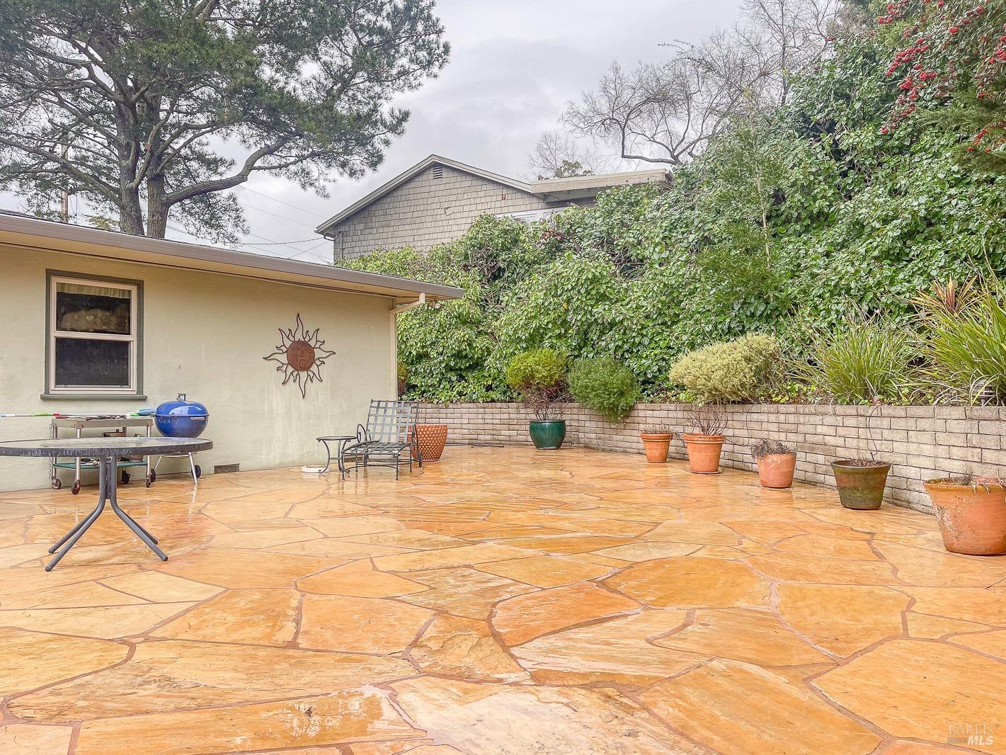 112 Reed Boulevard Mill Valley, CA 94941 - Photo 38 of 39 a view of a chairs and table in backyard of the house
