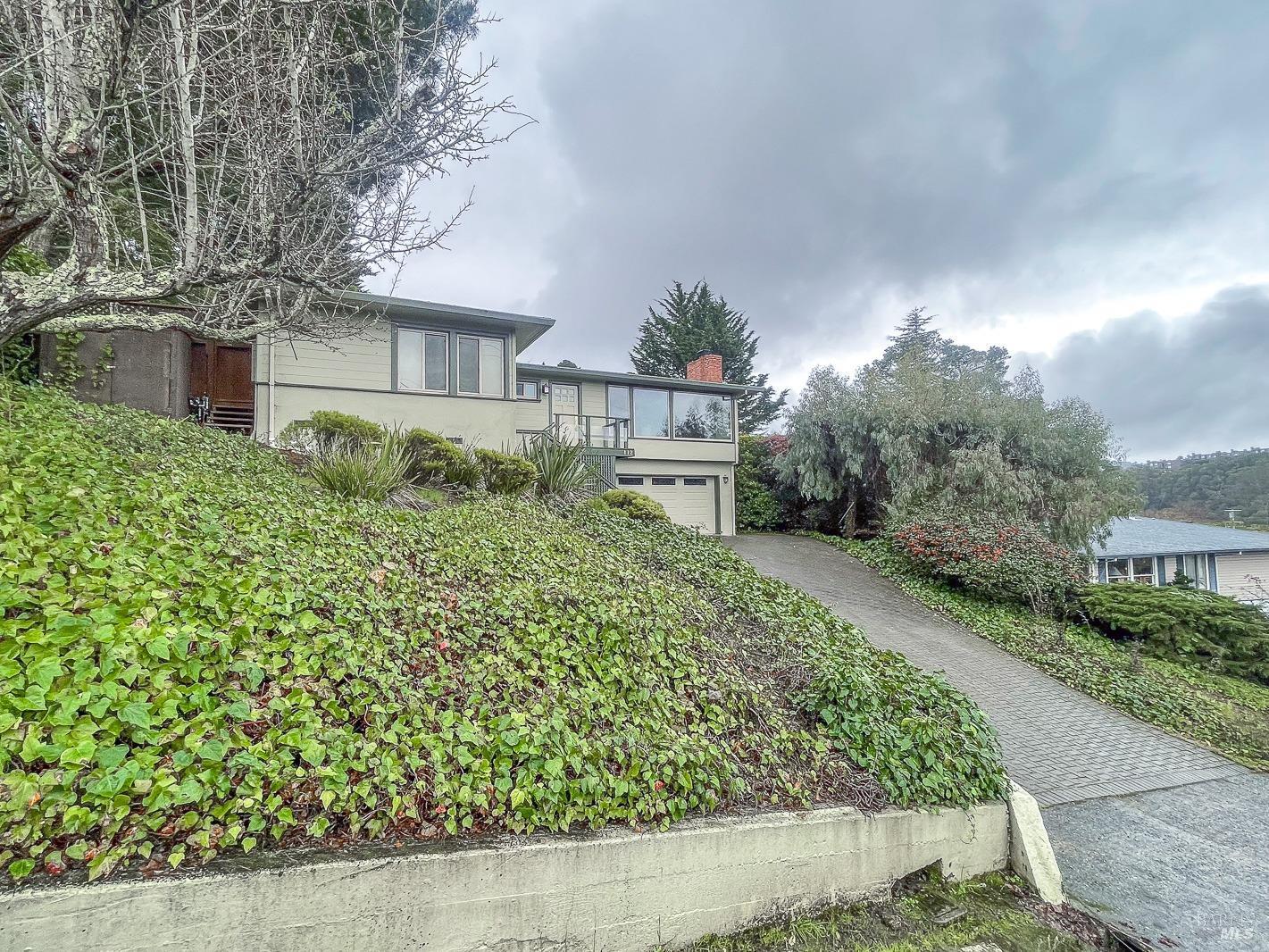 112 Reed Boulevard Mill Valley, CA 94941 - Photo 5 of 39 a front view of a house with a yard