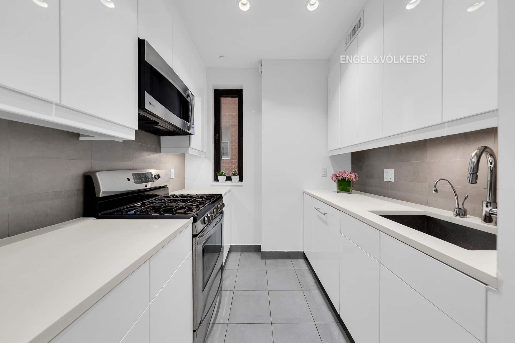 Undisclosed Address Manhattan, NY 10021 - Photo 6 of 18 a kitchen with stainless steel appliances granite countertop a sink and a stove