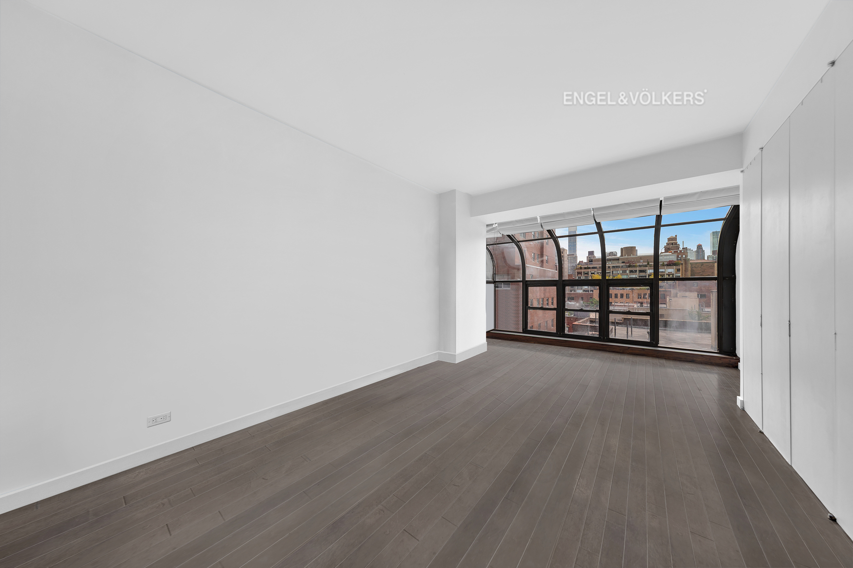 Undisclosed Address Manhattan, NY 10021 - Photo 9 of 18 wooden floor in an empty room with a window