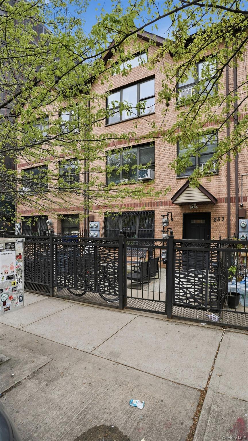 253 Cornelia Street Brooklyn, NY 11221 - Photo 1 of 36 a front view of a building with glass windows