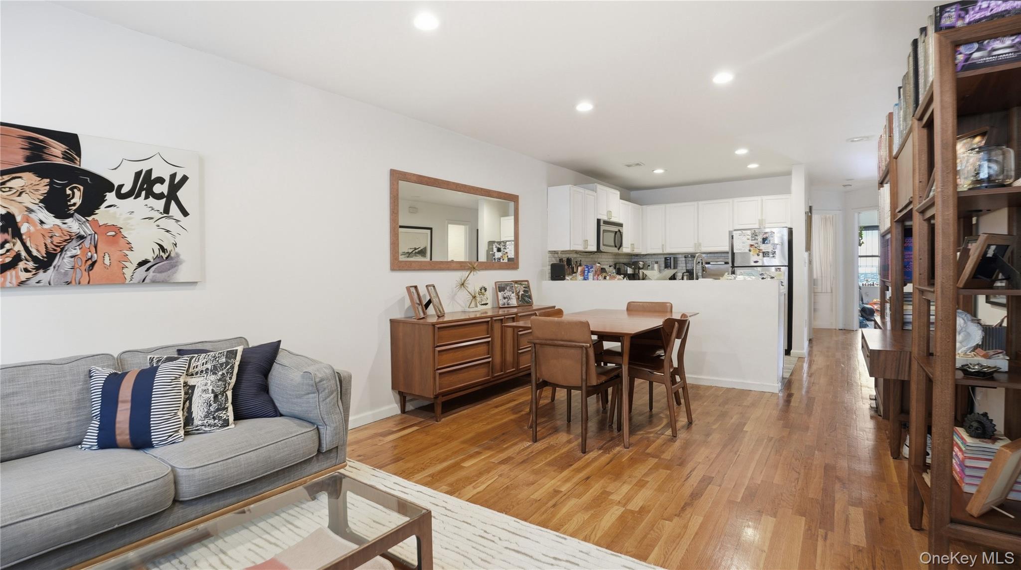 253 Cornelia Street Brooklyn, NY 11221 - Photo 24 of 36 a living room with lots of furniture and kitchen view