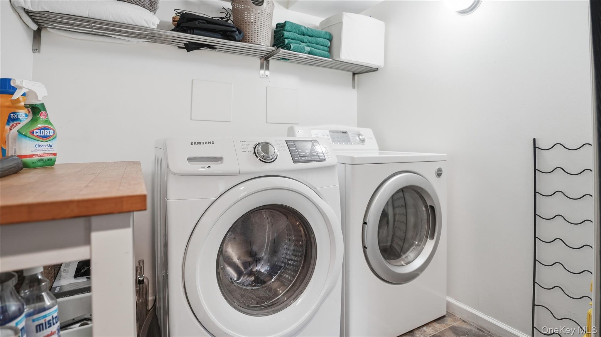 253 Cornelia Street Brooklyn, NY 11221 - Photo 30 of 36 a utility room with dryer and washer