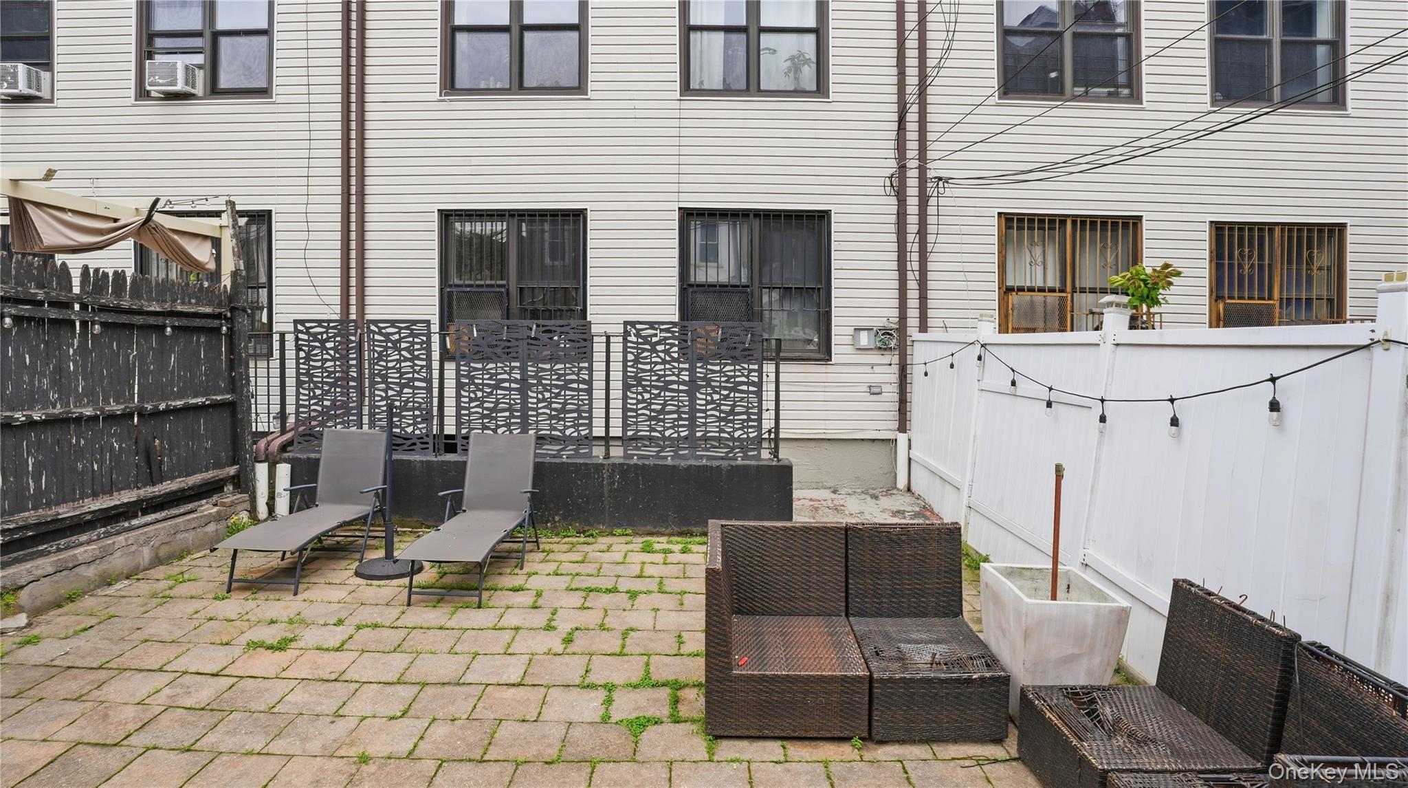 253 Cornelia Street Brooklyn, NY 11221 - Photo 31 of 36 a view of a patio with couple of chairs and a fireplace