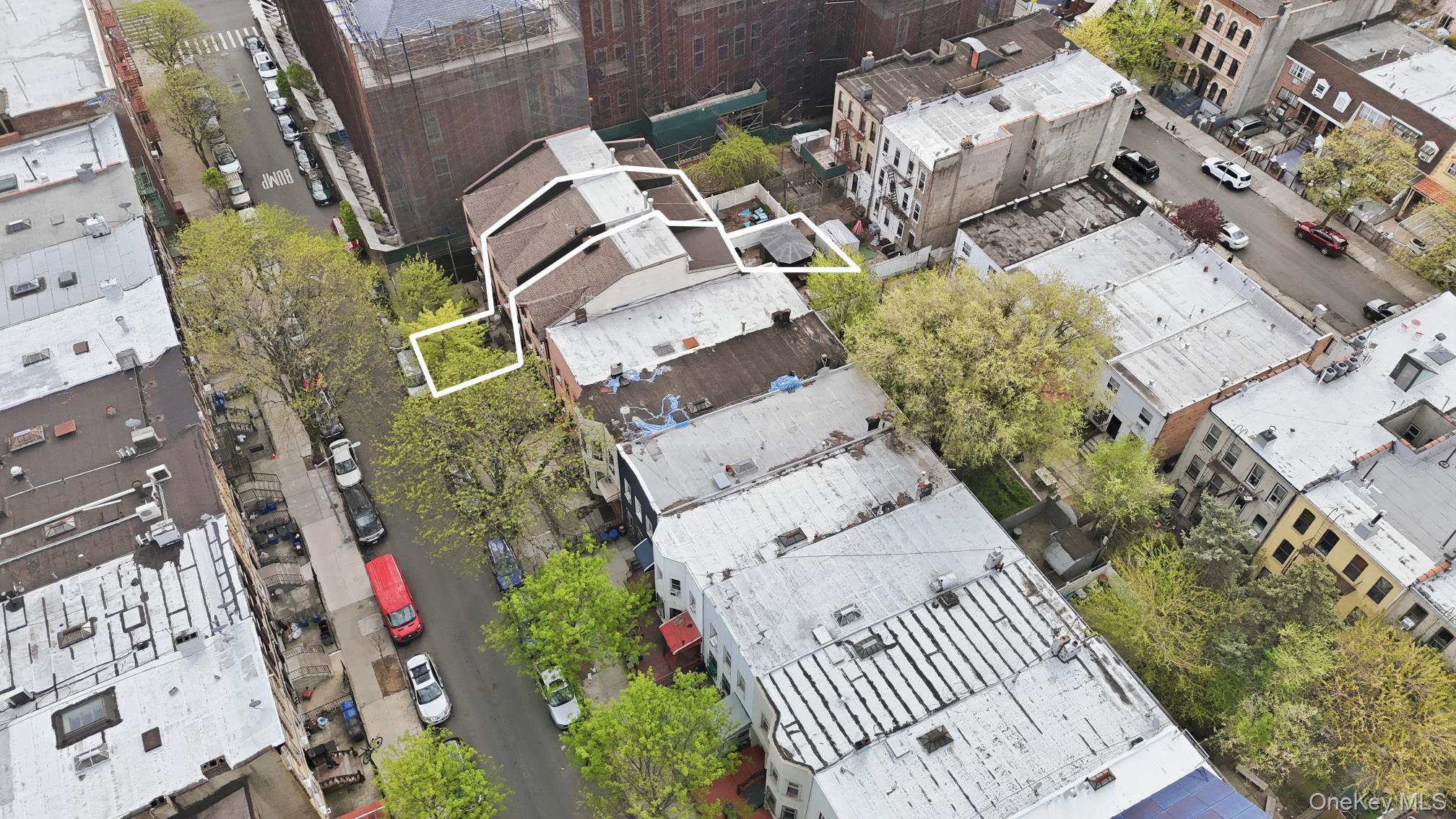253 Cornelia Street Brooklyn, NY 11221 - Photo 34 of 36 an aerial view of a house with a yard and fountain