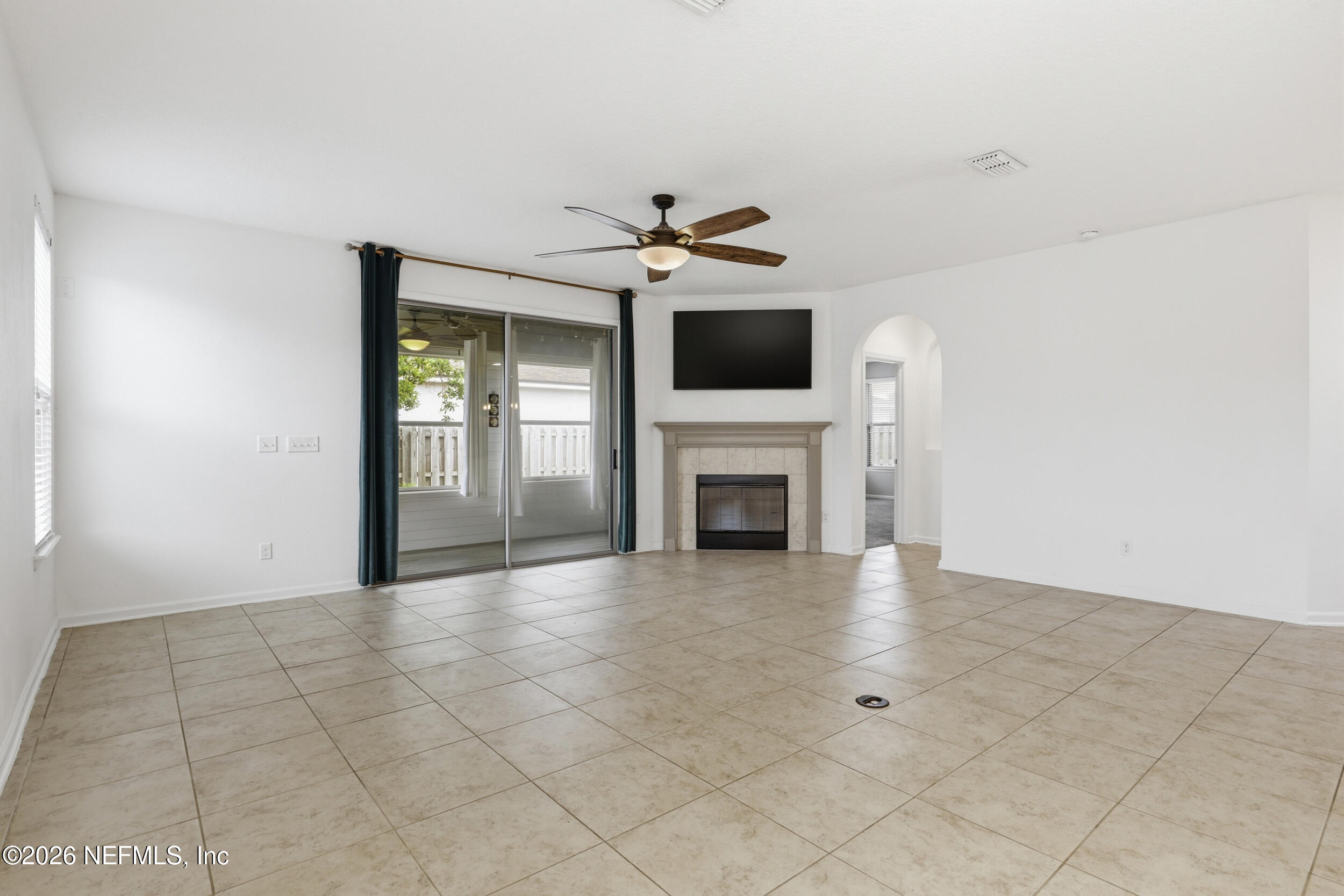 219 Straw Pond Way St. Augustine, FL 32092 - Photo 11 of 36 a view of an empty room with a fireplace