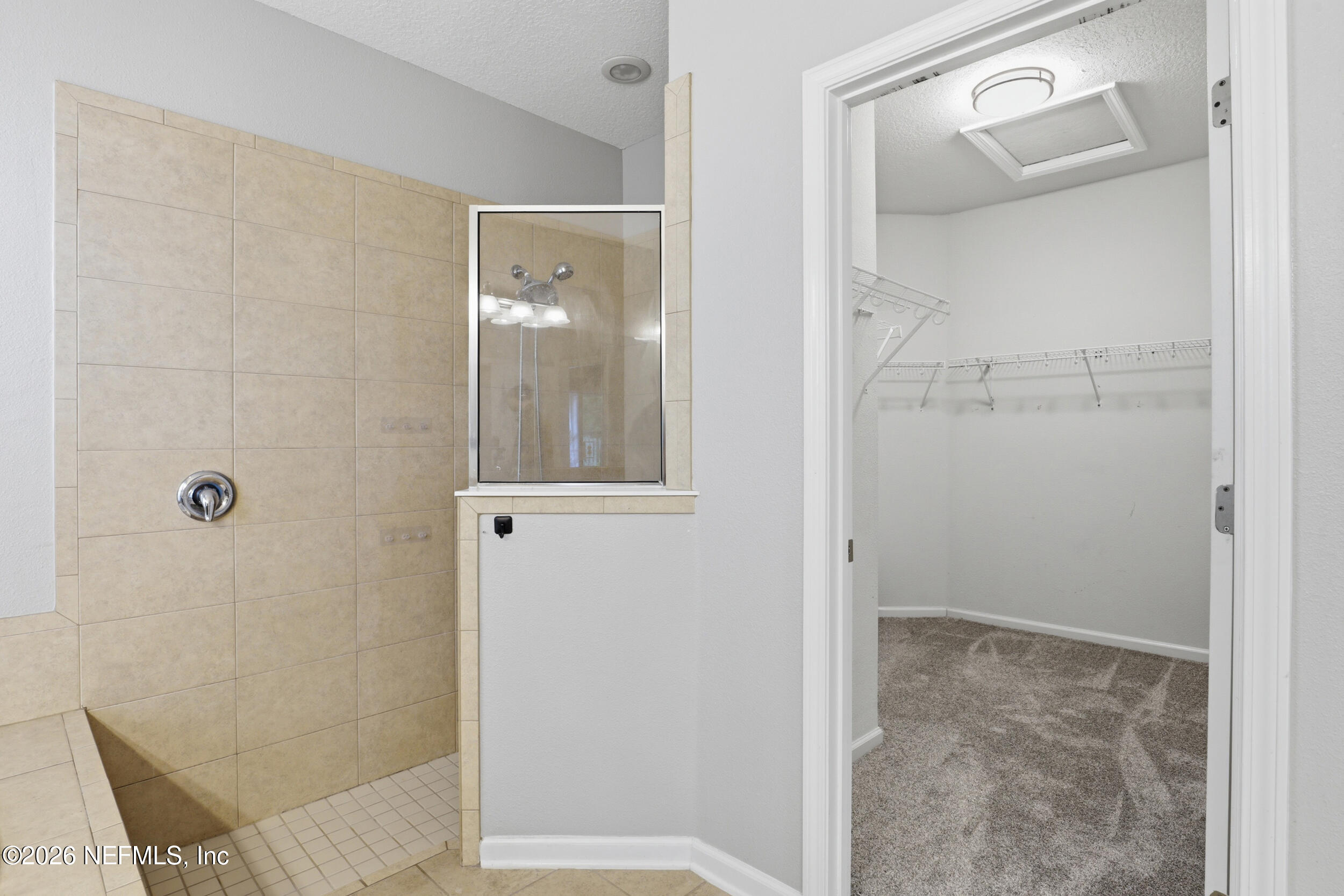 219 Straw Pond Way St. Augustine, FL 32092 - Photo 24 of 36 view of a bathroom with a glass shower door