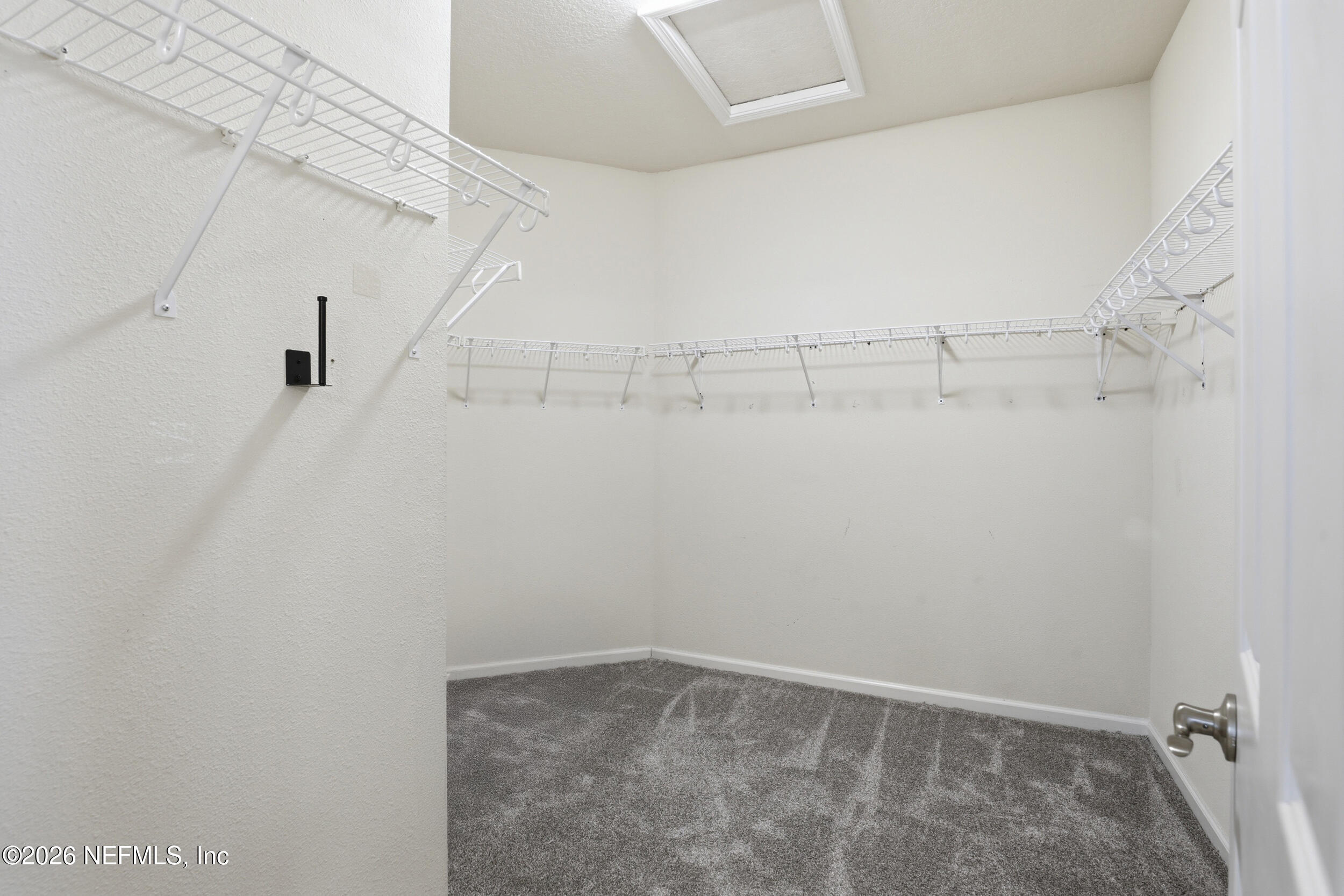 219 Straw Pond Way St. Augustine, FL 32092 - Photo 25 of 36 a view of a room with racks on the wall