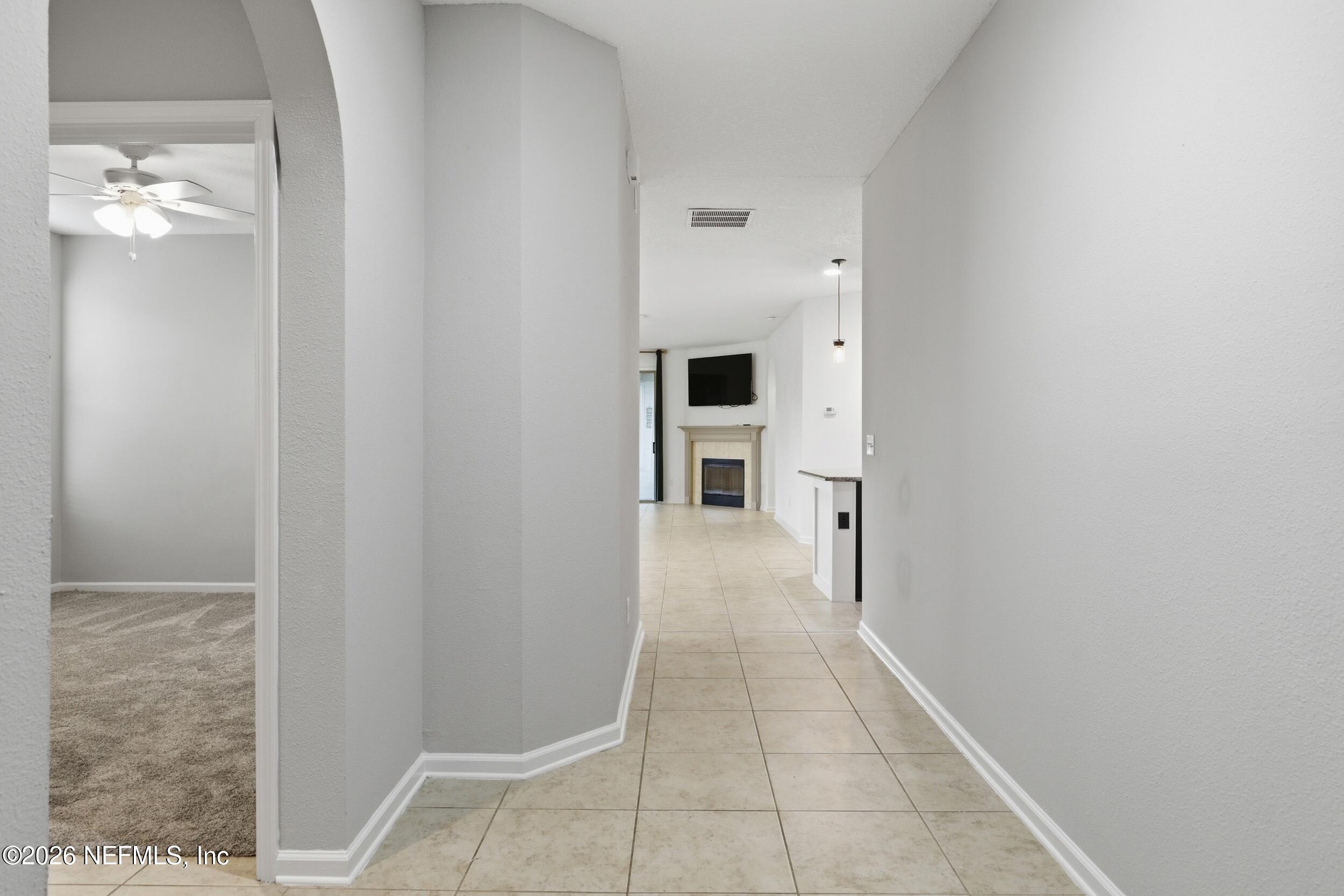 219 Straw Pond Way St. Augustine, FL 32092 - Photo 6 of 36 a view of a hallway with chandelier and entryway