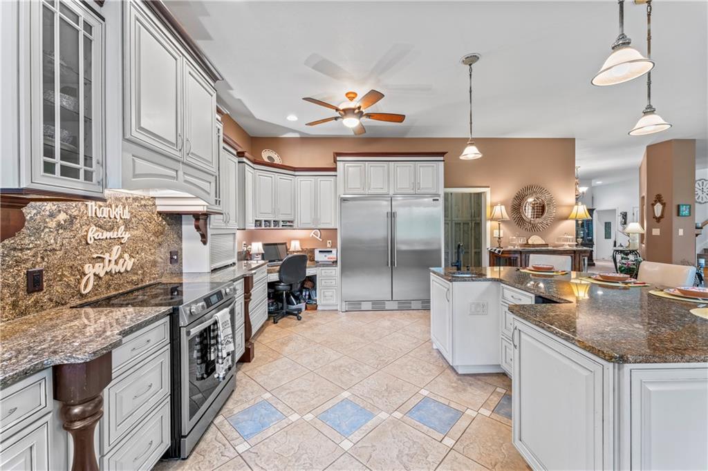 320 Holly Lane Walhalla, SC 29691 - Photo 29 of 41 This spacious kitchen offers ample countertop space and a functional layout for culinary creativity.