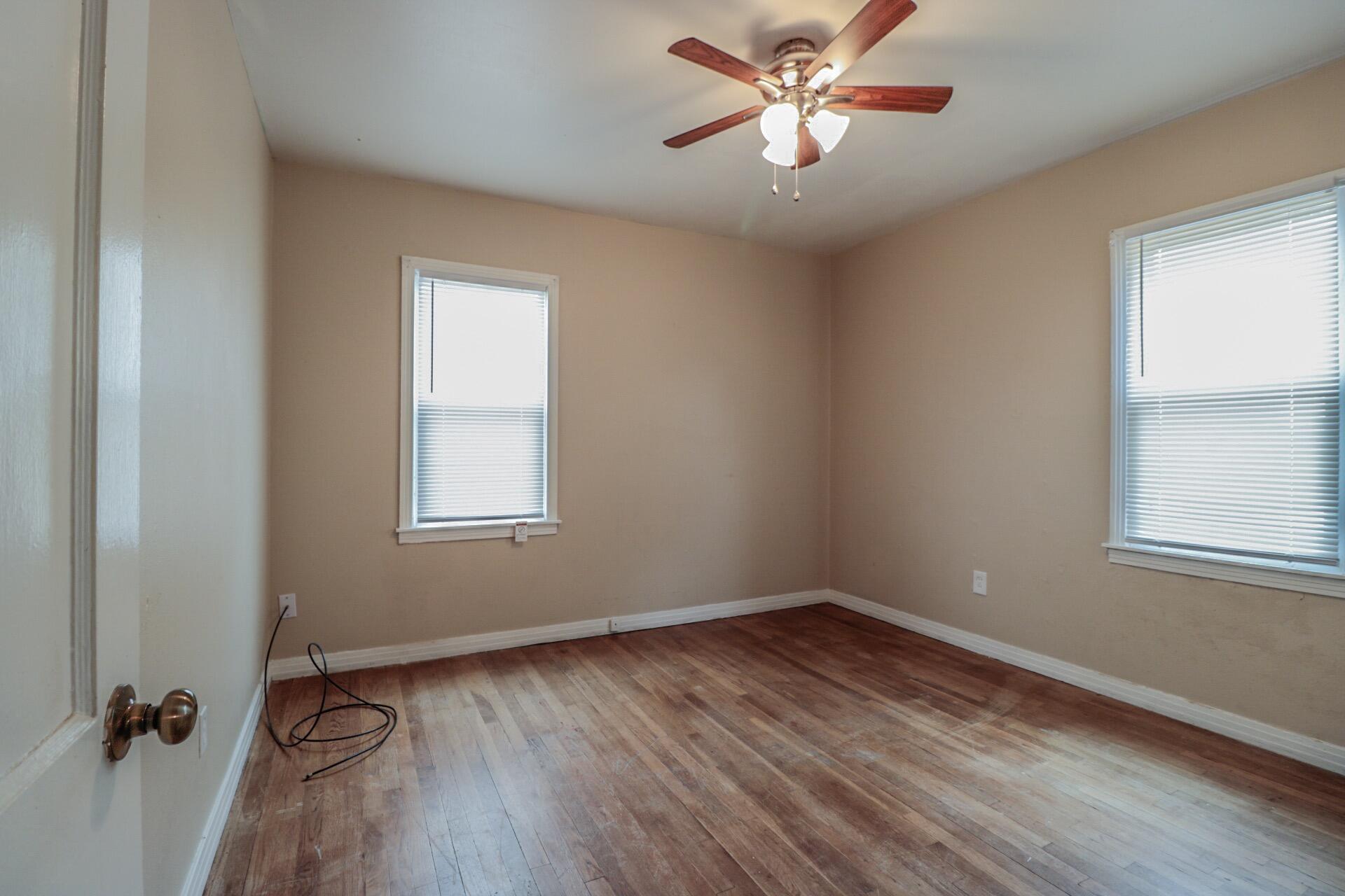 2509 36th Street Lubbock, TX 79413 - Photo 6 of 9 a view of a room with wooden floor and a window