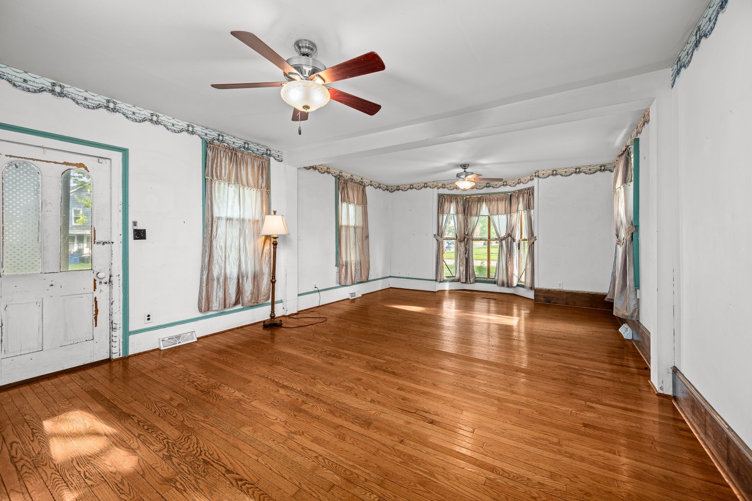 200 West Locust Street Cambridge, IL 61238 - Photo 19 of 32 a view of empty room with wooden floor and fan