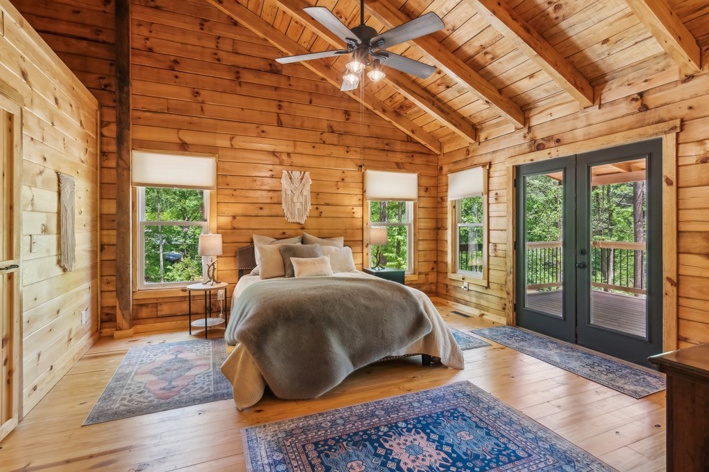 245 Timberwalk Drive Ellijay, GA 30540 - Photo 23 of 56 a bed sitting in a bedroom next to a window