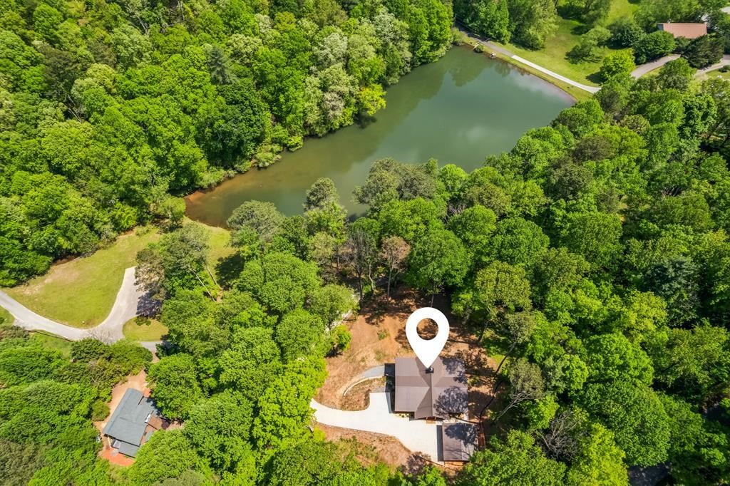 245 Timberwalk Drive Ellijay, GA 30540 - Photo 4 of 56 a bird view of a house with a yard and lake view