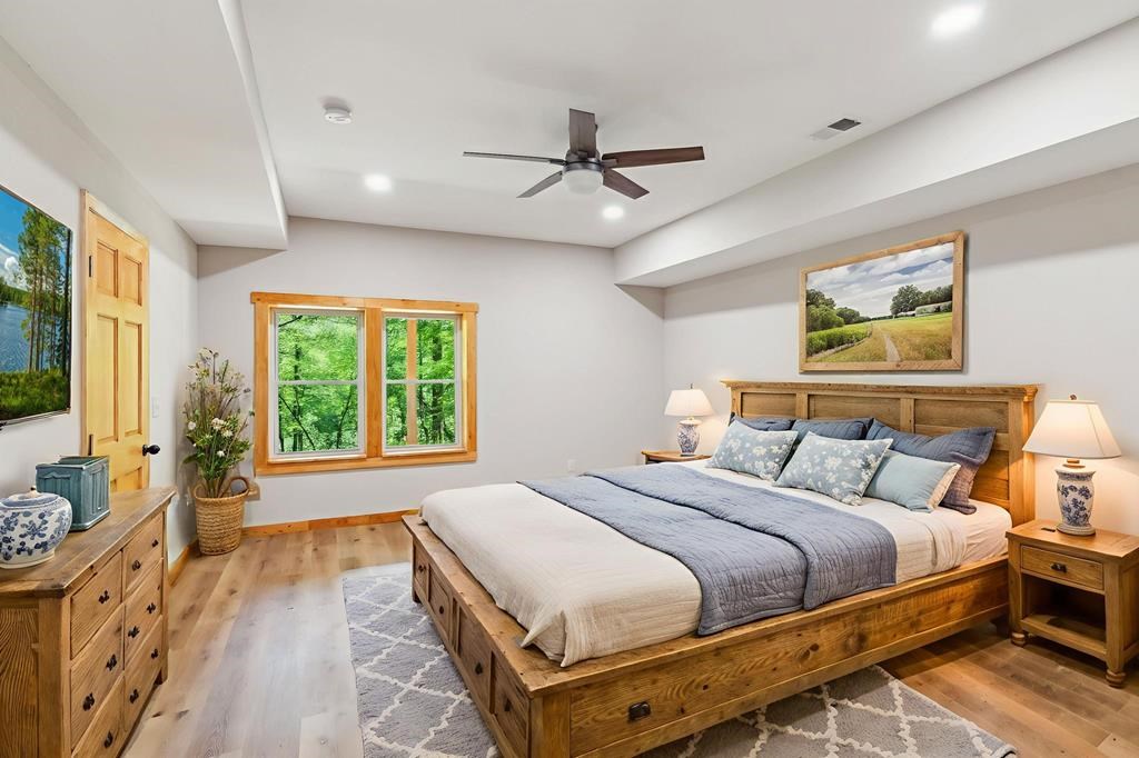 245 Timberwalk Drive Ellijay, GA 30540 - Photo 54 of 56 a bedroom with a bed and a large window