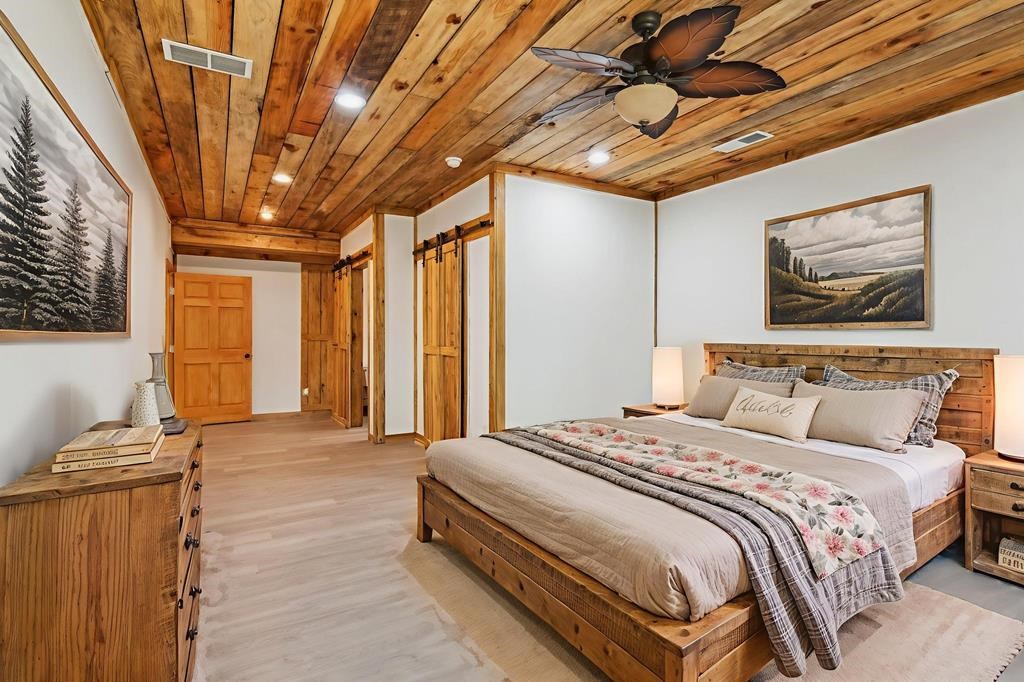 245 Timberwalk Drive Ellijay, GA 30540 - Photo 55 of 56 a spacious bedroom with a bed and a furniture