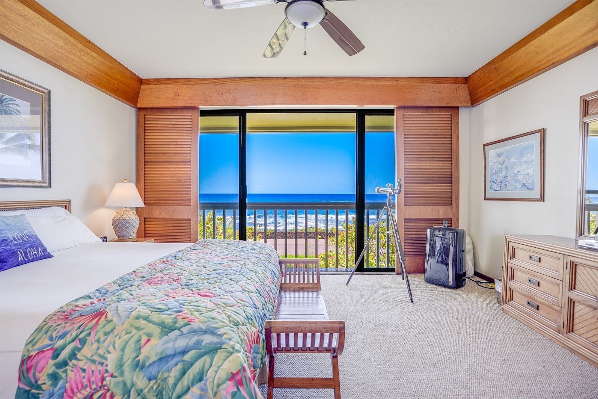 2221 Kapili Road, Unit 58 Koloa, HI 96756 - Photo 11 of 30 a bedroom with a bed and a painting on the wall