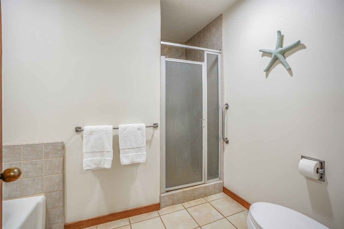 2221 Kapili Road, Unit 58 Koloa, HI 96756 - Photo 15 of 30 a bathroom with a toilet and a shower