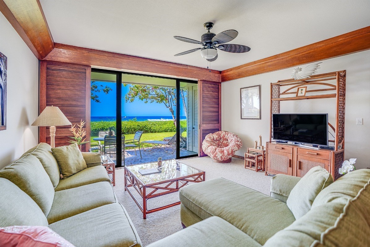2221 Kapili Road, Unit 58 Koloa, HI 96756 - Photo 3 of 30 a living room with furniture and a flat screen tv