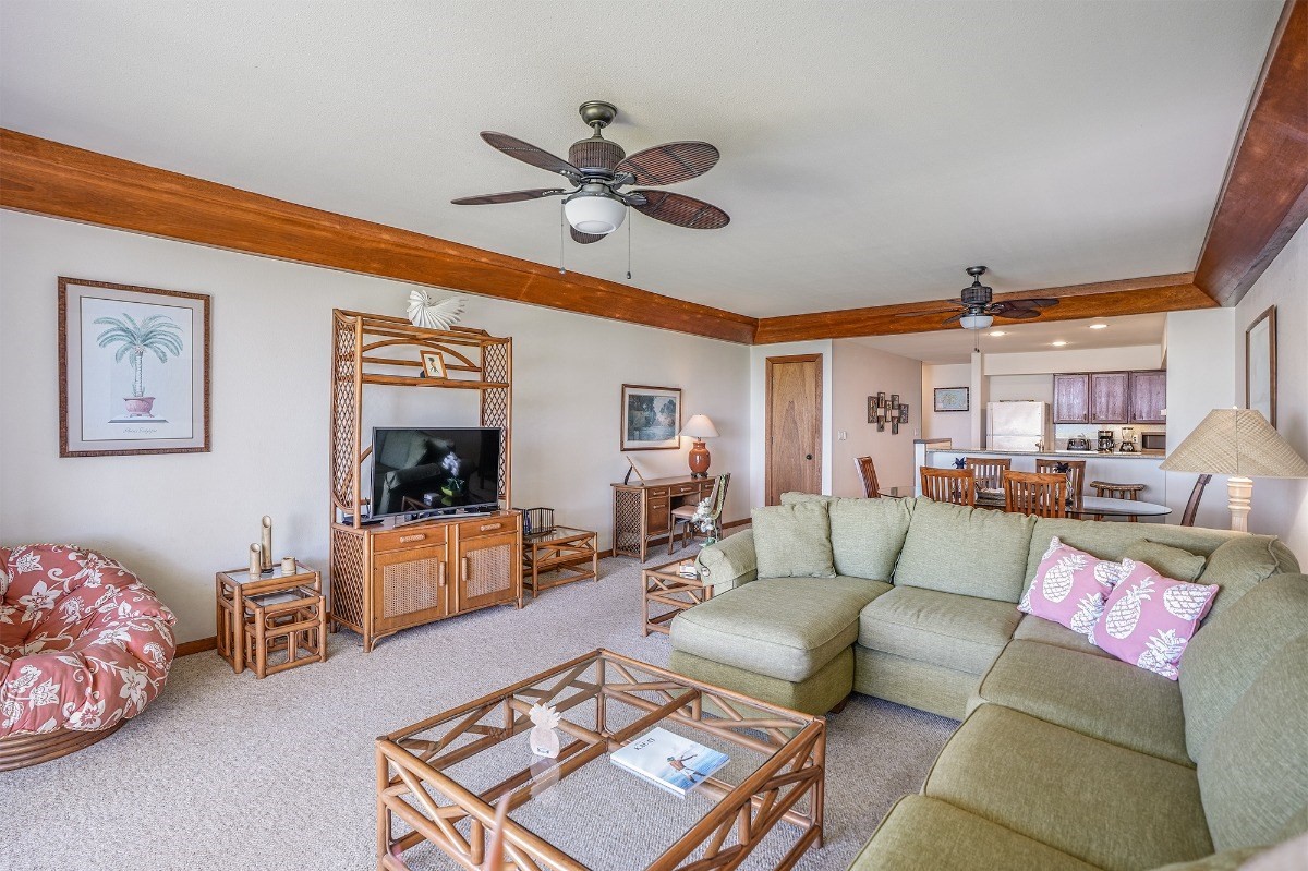 2221 Kapili Road, Unit 58 Koloa, HI 96756 - Photo 7 of 30 a living room with furniture and a flat screen tv