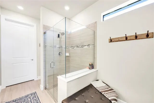 a bathroom with a shower and a sink