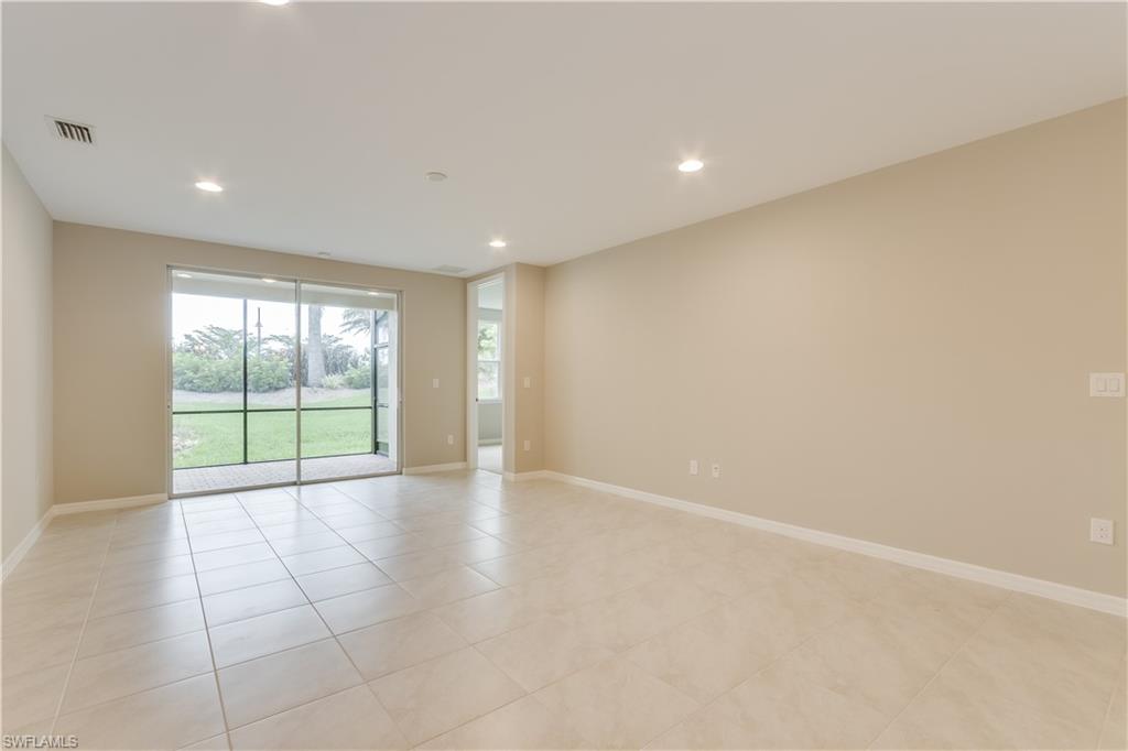14863 Edgewater Circle Naples, FL 34114 - Photo 12 of 35 a view of an empty room with a window