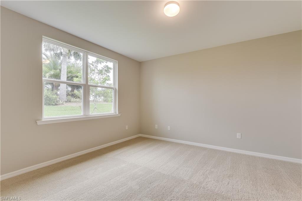 14863 Edgewater Circle Naples, FL 34114 - Photo 13 of 35 an empty room with a window