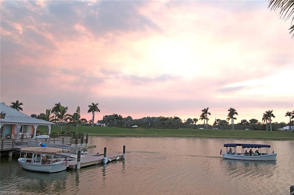 14863 Edgewater Circle Naples, FL 34114 - Photo 23 of 35 a view of a lake with sitting area
