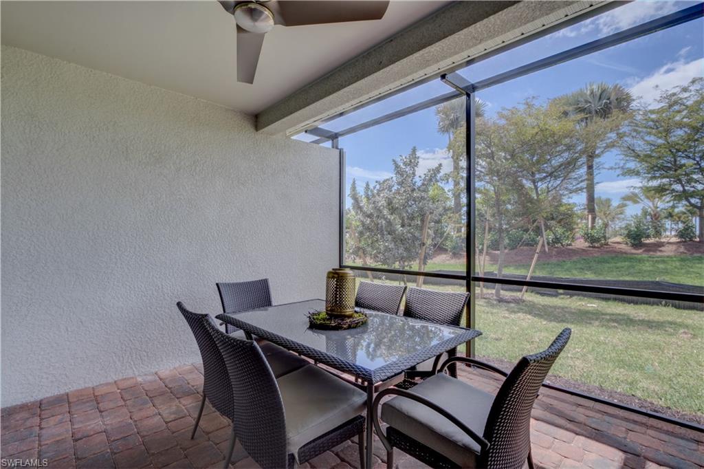 14863 Edgewater Circle Naples, FL 34114 - Photo 28 of 35 a view of a dining room with furniture and wooden floor