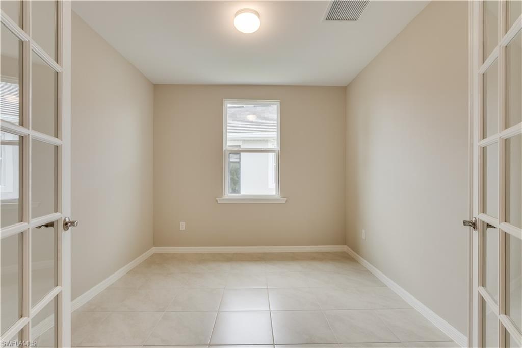 14863 Edgewater Circle Naples, FL 34114 - Photo 10 of 35 an empty room with a window