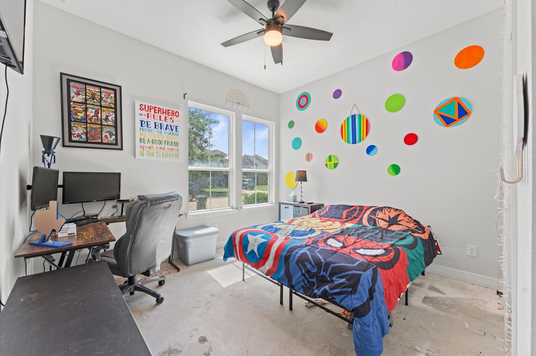 3510 Whitman Drive Rosharon, TX 77583 - Photo 12 of 25 This bright bedroom features large windows, a ceiling fan and neutral walls.