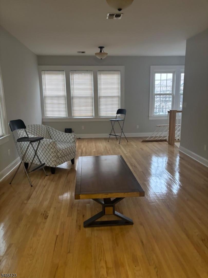 917 Madison Avenue Elizabeth, NJ 07201 - Photo 6 of 13 a living room with table chairs and a window