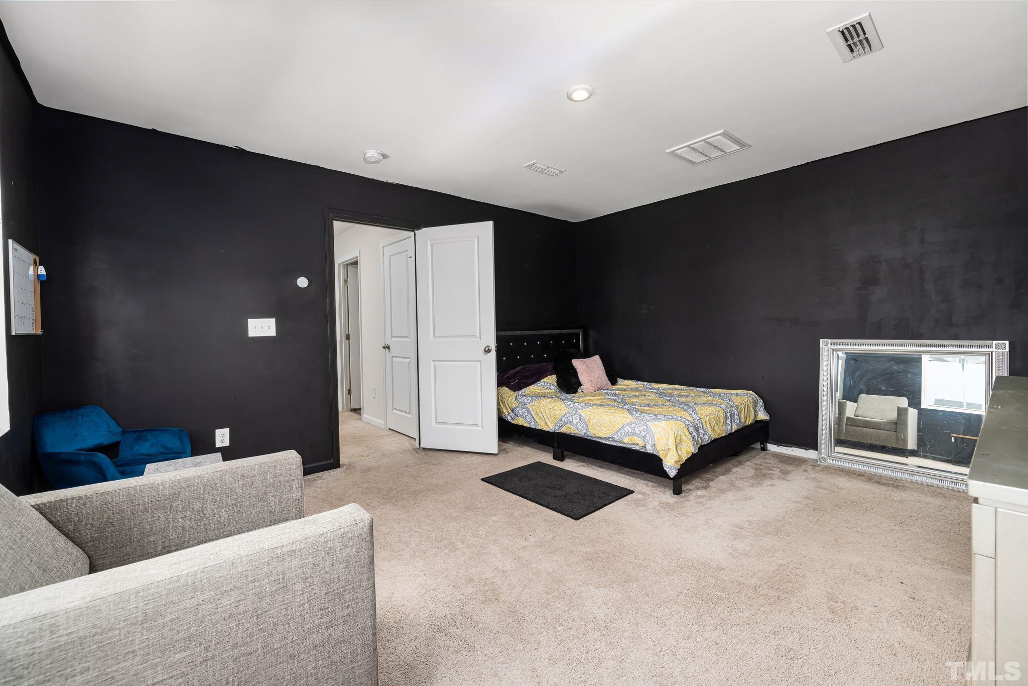 32 Powder Court Angier, NC 27501 - Photo 7 of 14 a bedroom with a bed and a couch