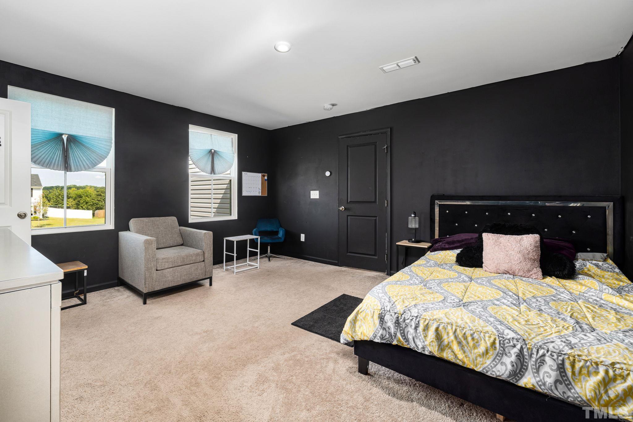 32 Powder Court Angier, NC 27501 - Photo 8 of 14 a bedroom with a bed and couch