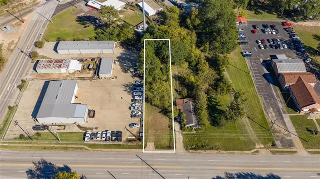 an aerial view of residential house with outdoor space