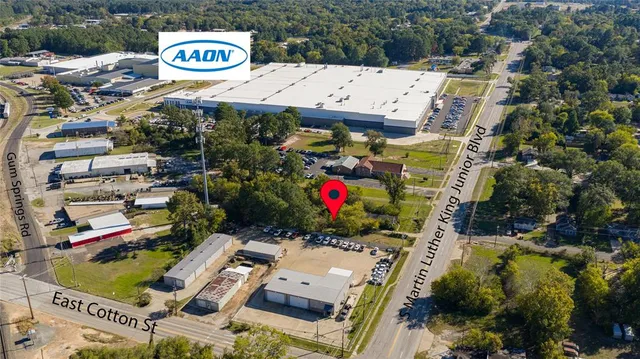 an aerial view of residential house with outdoor space and seating area