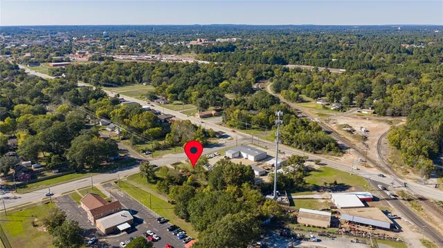 an aerial view of a houses with a yard