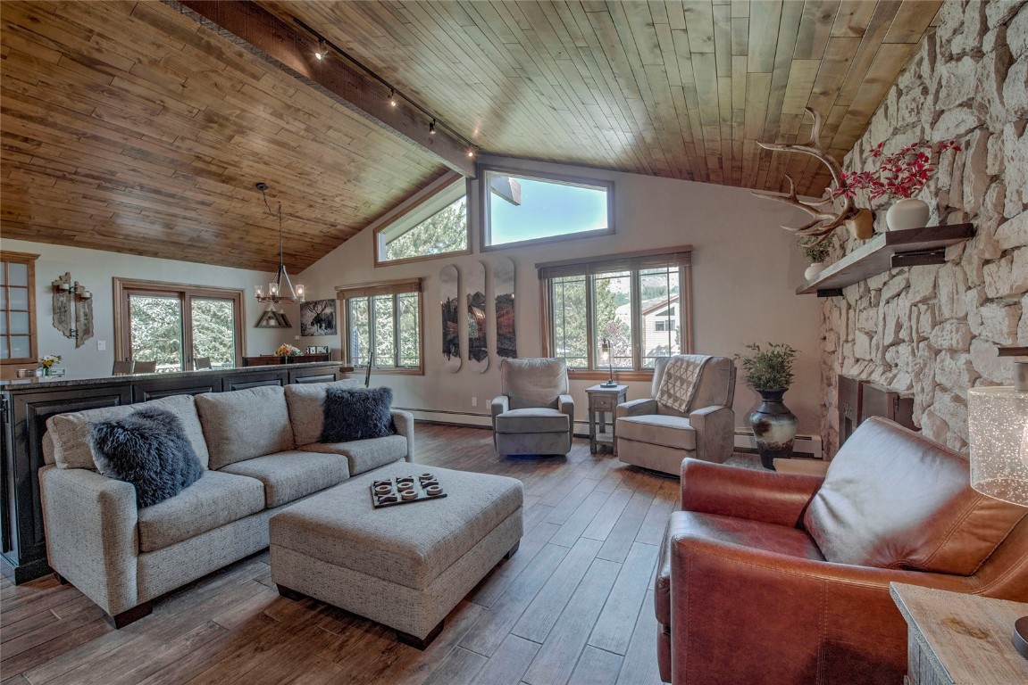 74 Big Elk Road Dillon, CO 80435 - Photo 1 of 37 a living room with furniture wooden floor and a fireplace