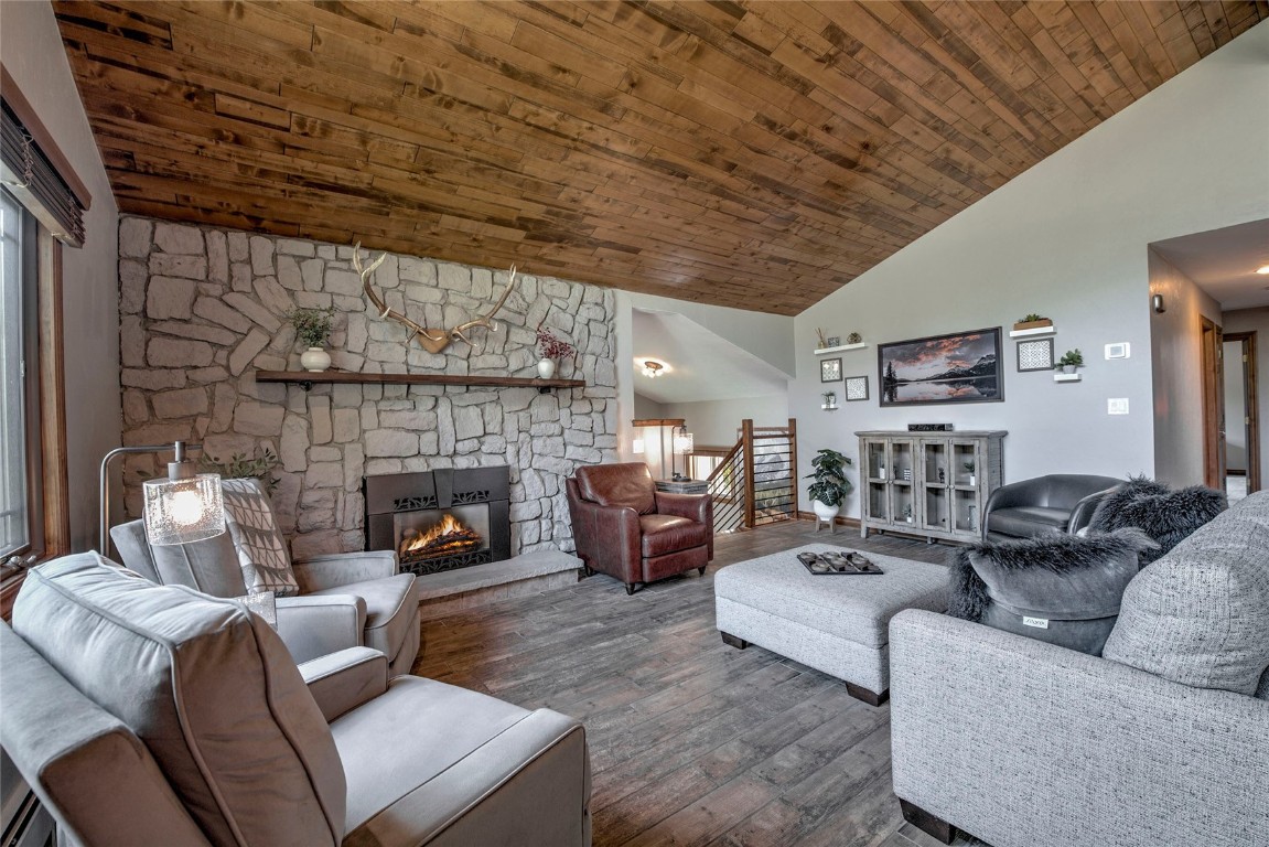 74 Big Elk Road Dillon, CO 80435 - Photo 2 of 37 a living room with furniture and a fireplace